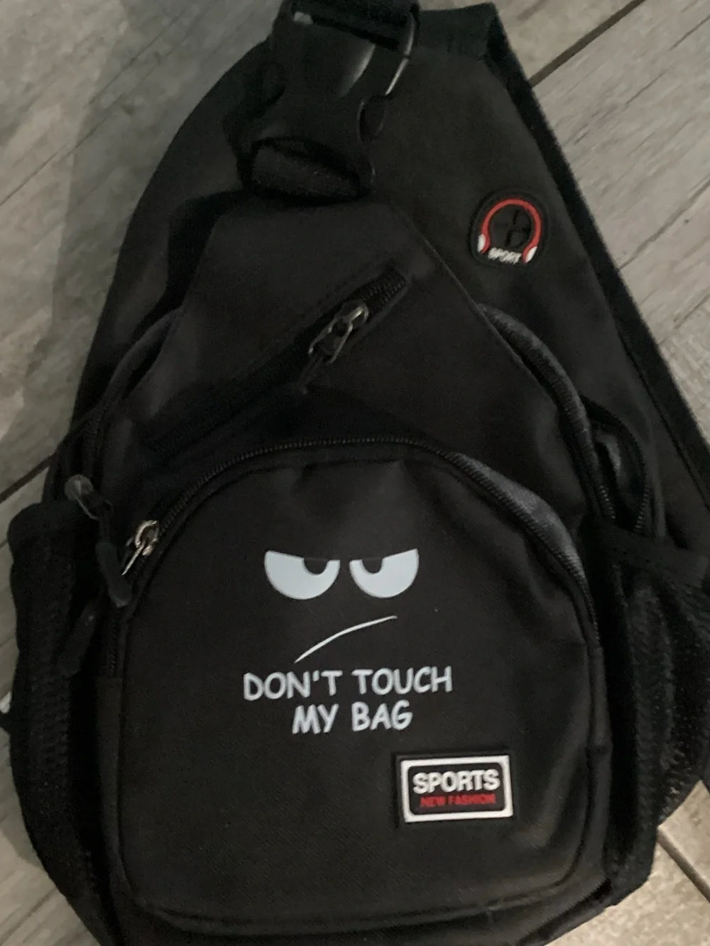 Black Sling Backpack with 'Don't Touch My Bag' Graphic